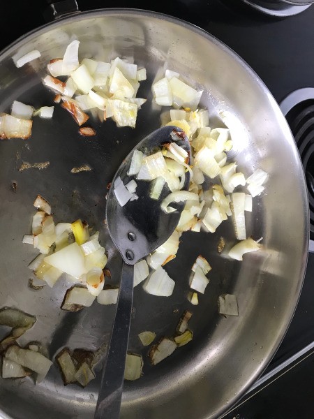 sauteing onions in pan