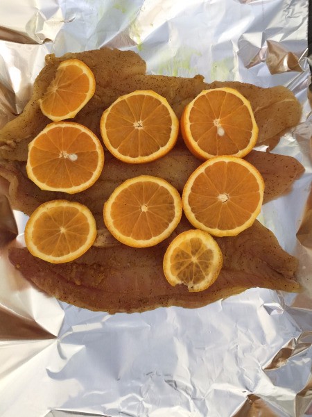 seasoned Rockfish with orange slices