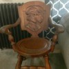 Identifying an Antique Chair - old chair with a carving of the bust of a man wearing a hat and smoking a pipe