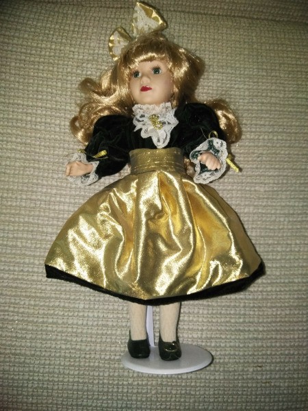 Selling Porcelain Dolls - doll in gold and black short fancy dress