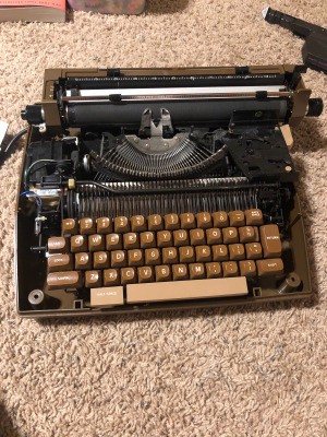 Repairing a Smith Corona Typewriter - black manual typewriter