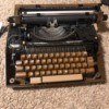 Repairing a Smith Corona Typewriter - black manual typewriter
