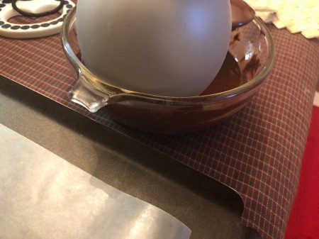 dipping balloon in Chocolate