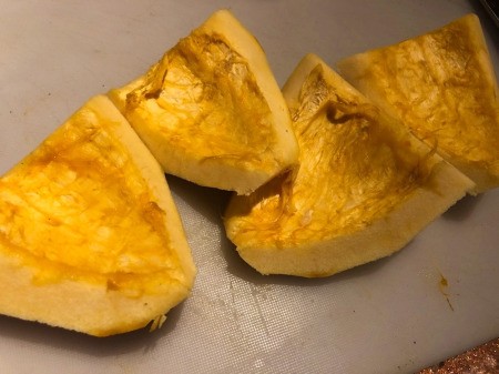 Acorn Squash peeled, seeds removed in quarters