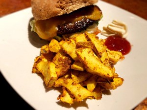 Acorn Squash Fries on plate with sandwich