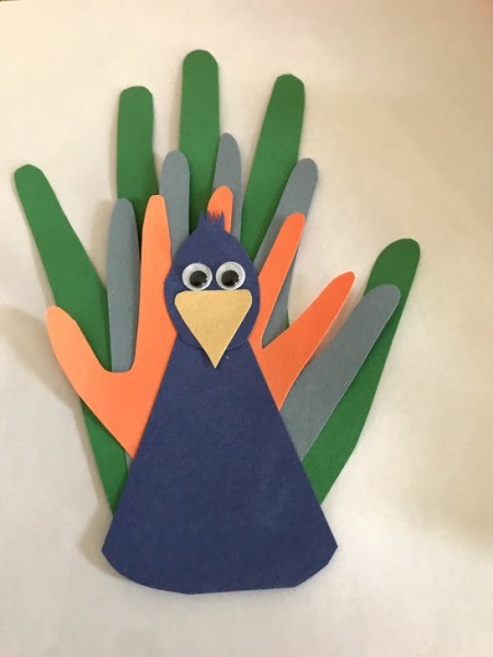 Peacock Popsicle Stick Puppet - glue on googly eyes