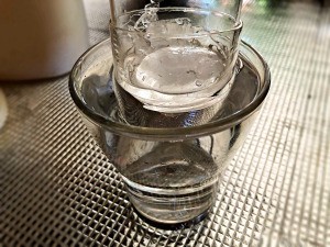 Two glasses that are stuck together.