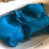 How to Care for Your Swimwear - suit soaking in vinegar water