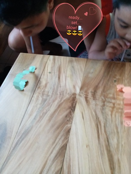 Making a Paper Worm Race Game - kids blowing