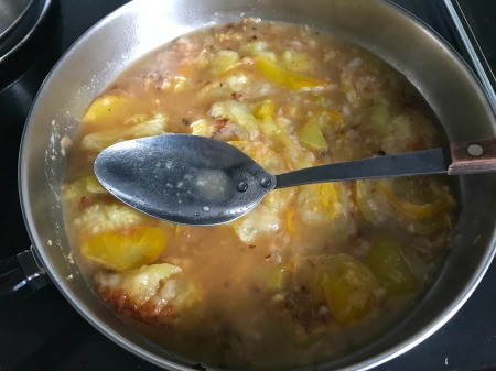 stirring Brown Tomato Gravy