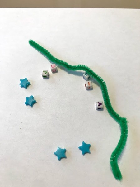 Personalized Turtle Wall Art Using Old Art - letter and star beads and a green pipe cleaner