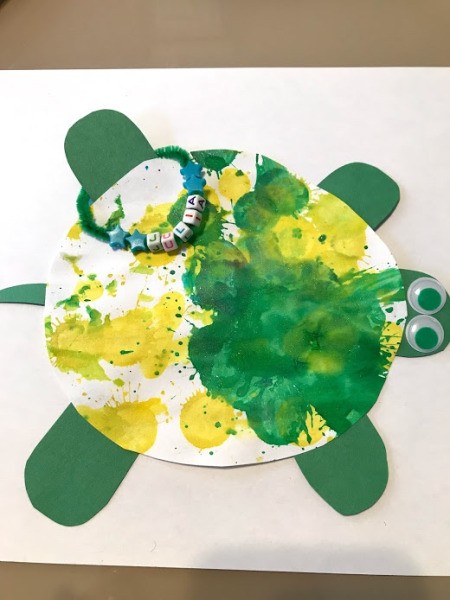 Personalized Turtle Wall Art Using Old Art - secure the name tag onto the turtle, looped over leg in this photo