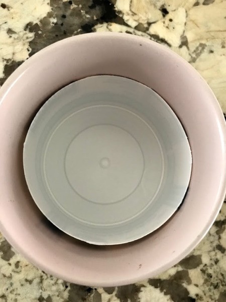 Hide the Plant Saucer Inside the Pot - cut down container inside a flower pot