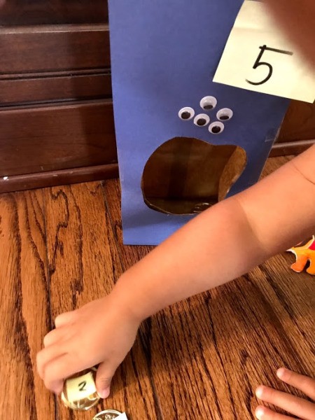 Feed the Monster Math Game - child collects coins that equal that total