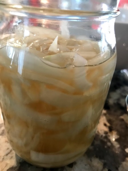 pickling juice on Onions in jar