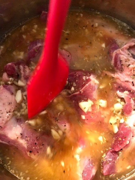 adding sauce to cooking pot