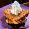 Cornflake Crusted Cinnamon French Toast with whipped cream & syrup