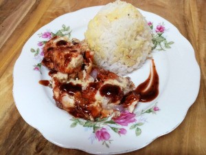 Chicken Egg Roll on plate with rice