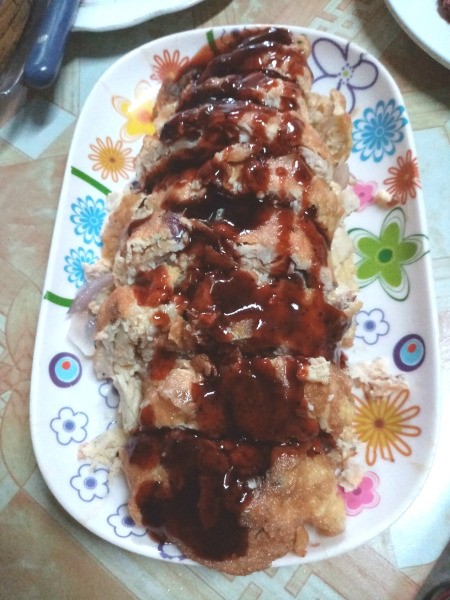 Chicken Egg Roll with sauce on plate