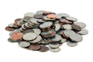 A pile of coins on a white background.