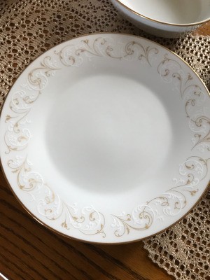 Value of Noritake China - white plate with a gold and white scroll pattern
