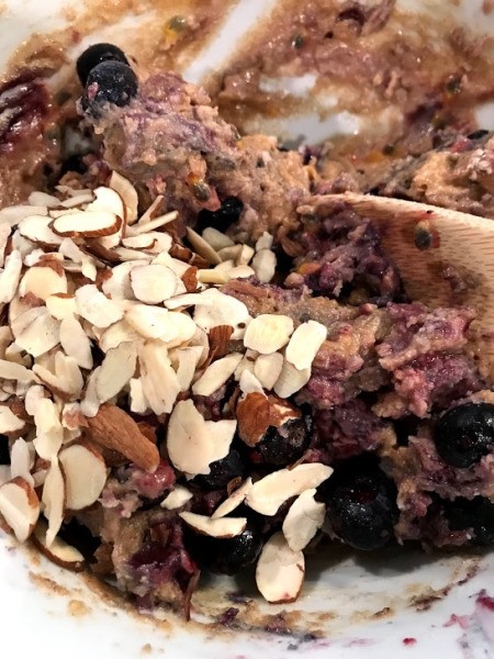 adding almonds to dough