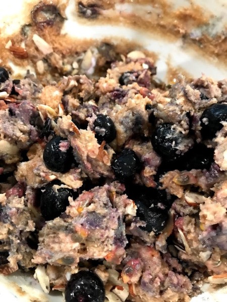 mixing in blueberries & passionfruit