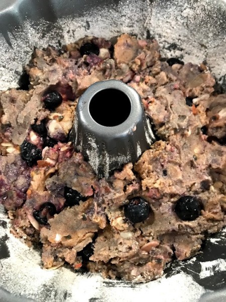 adding dough to Bundt pan