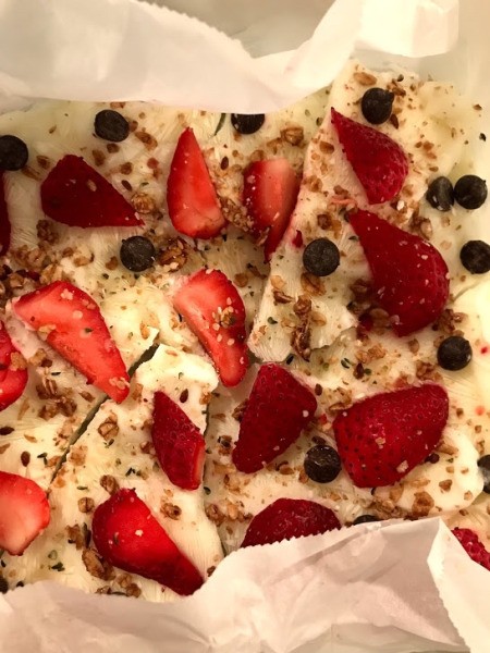 Frozen Yogurt Bark on parchment paper