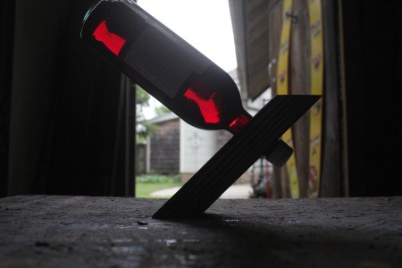 DYI Wine Bottle Holder - backlit photo of the holder