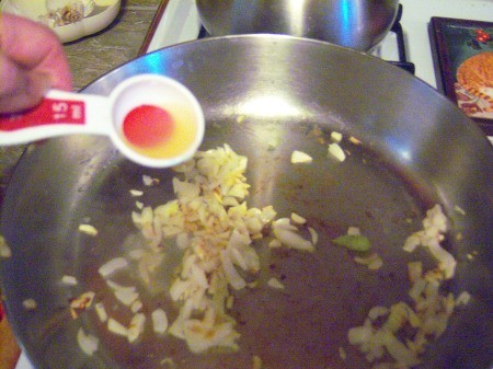 adding vinegar to garlic & onions