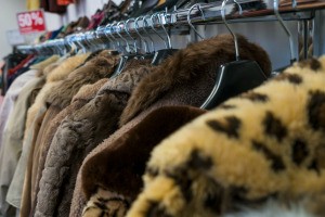 A row of faux fur jackets.