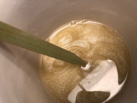 How to Make Natural Tinted Lip  Balm - stir with a stick and add more glitter if desired