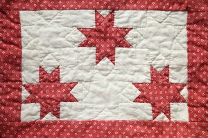 A red and white quilt.