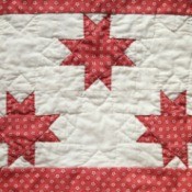 A red and white quilt.