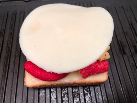 Cheese added to sandwich