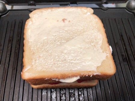 buttered bread on top on top of sandwich