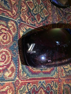 Identifying the Brand on a Pair of Sunglasses - gray or silver logo near the hinge