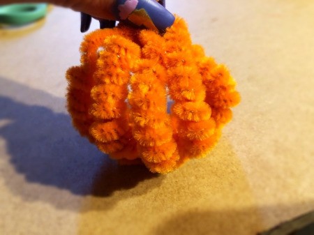 Pipe Cleaner Pumpkin Craft - pull up the other ends and tie together creating a sphere