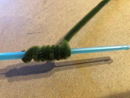 Pipe Cleaner Pumpkin Craft - wrap green pipe cleaner to create the vines
