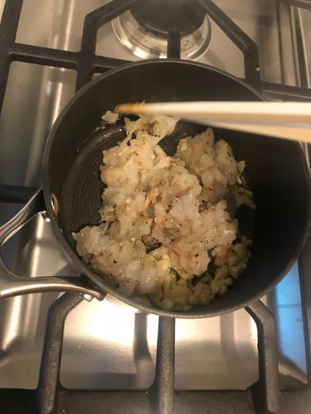 adding shrimp to pan