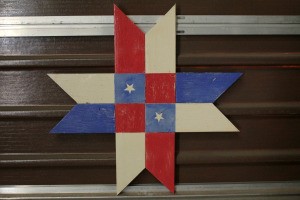 Wooden Barn Star Quilt Pattern - red, white, and blue star with two white stars on blue center squares