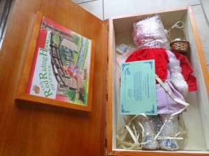 Value of  Fairytale Collection Porcelain Dolls - Red Riding Hood doll still wrapped in plastic in a wood box
