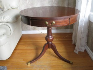 Value of a Mersman Table - round mahogany table with single drawer