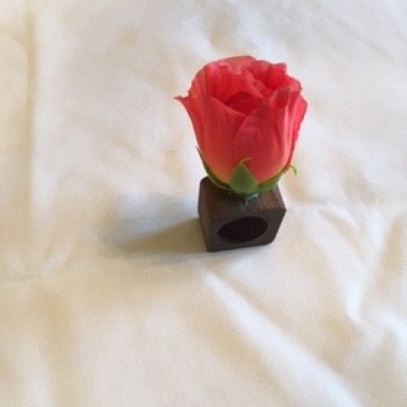 Wedding Reception Table Topper - glue one large rose to the top of a napkin ring