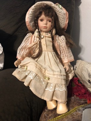 Value of a Porcelain Doll - doll wearing a long pink dress