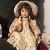 Value of a Porcelain Doll - doll wearing a long pink dress