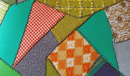 A crazy quilt made from scraps of material.