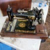 Value of a Vintage Hamilton Beach Sewing Machine - black and gold decorated vintage sewing machine in wood carrying case
