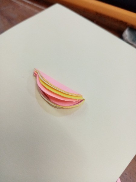 Making a Balloon Paper Clip Topper - fold the cutouts in half